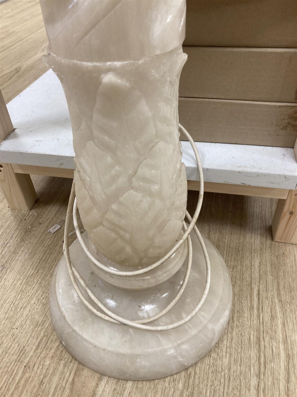 A white carved alabaster pedestal, 80cm high